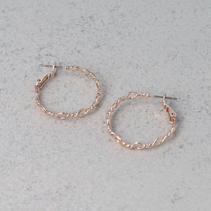 ピアス ニッケルフリー ロゼシルバー ランダム ひねり オーバル チタンポスト フープピアス